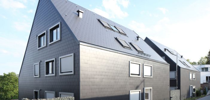 Mehrfamilienhäuser in Leonberg: Die Doppeldeckung aus blauschwarzen Dachplatten 32/60 ermöglicht eine exakte Detailausbildung mit scharfkantigen, überstandslosen Gebäudekanten und betont die homogene, geschlossene Form der beiden Baukörper.